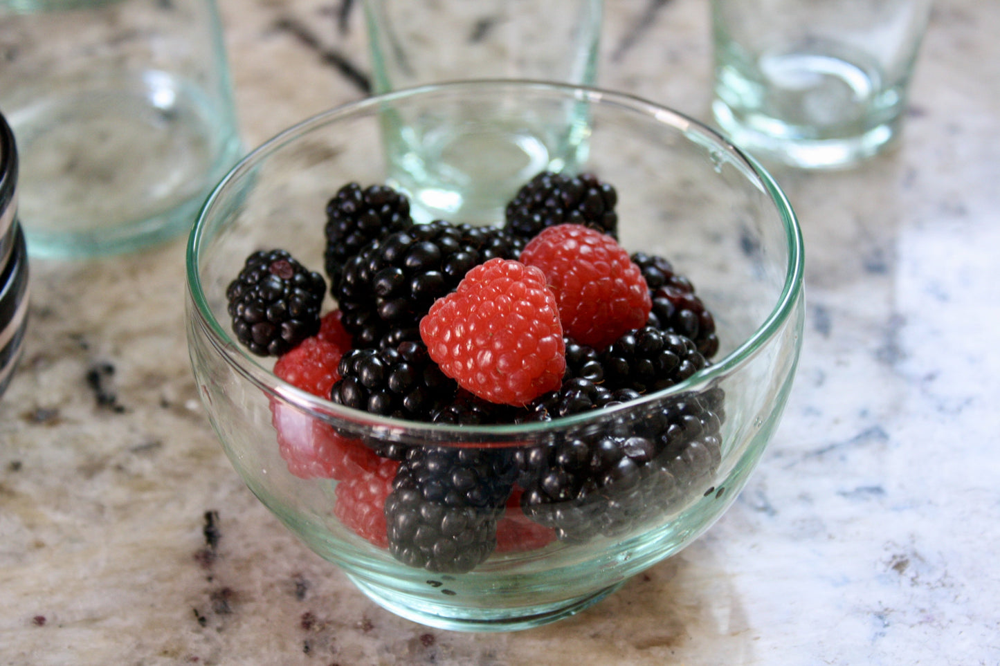 Set of 4 handblown dessert bowls handmade in Morocco from recycled glass by artisans using traditional techniques since 1946.