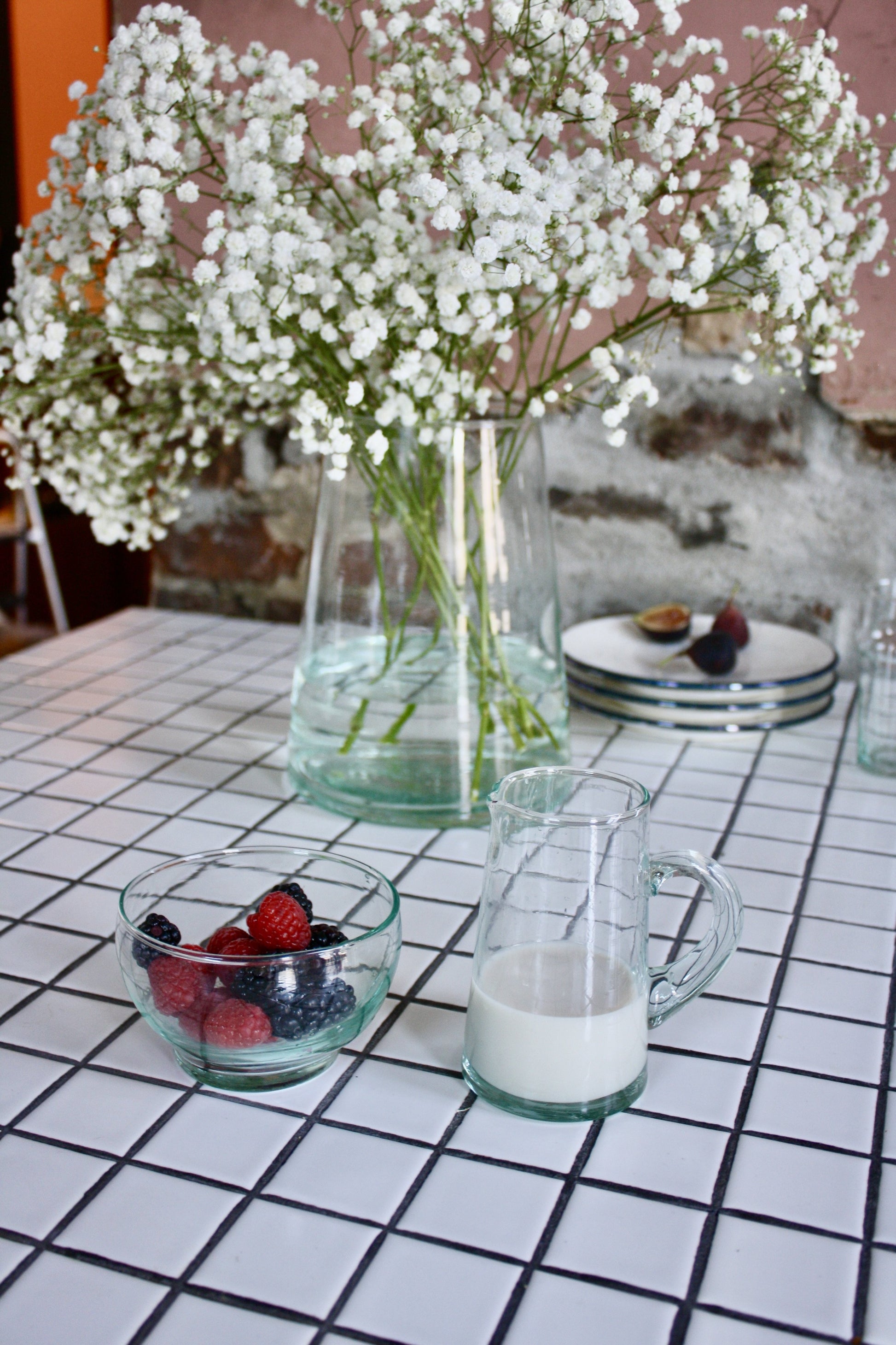 Set of 24 handblown dessert bowls handmade in Morocco from recycled glass by artisans using traditional techniques since 1946.