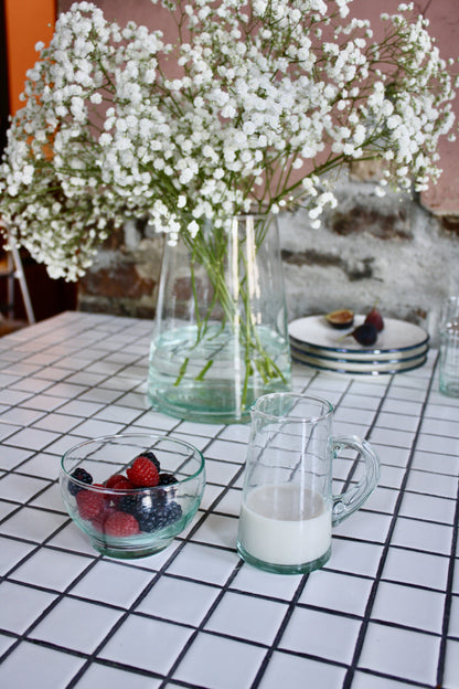 Set of 24 handblown dessert bowls handmade in Morocco from recycled glass by artisans using traditional techniques since 1946.