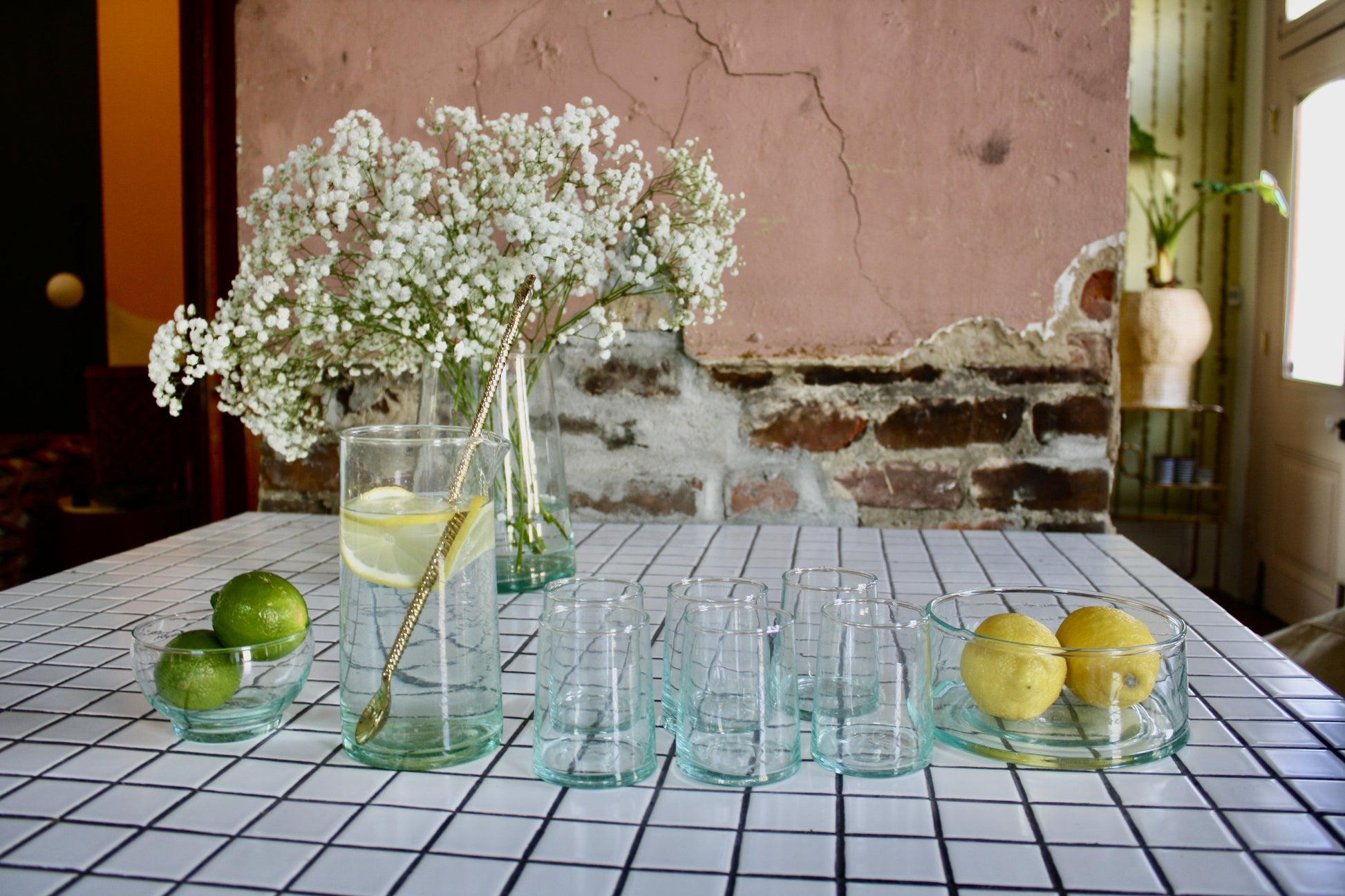 Set of 12 handblown cocktail glasses handmade in Morocco from recycled glass by artisans using traditional techniques since 1946.